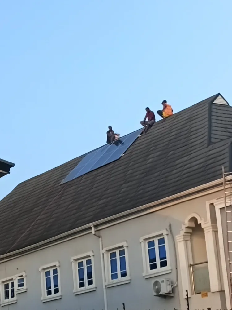 Solar installation team working on a residential rooftop